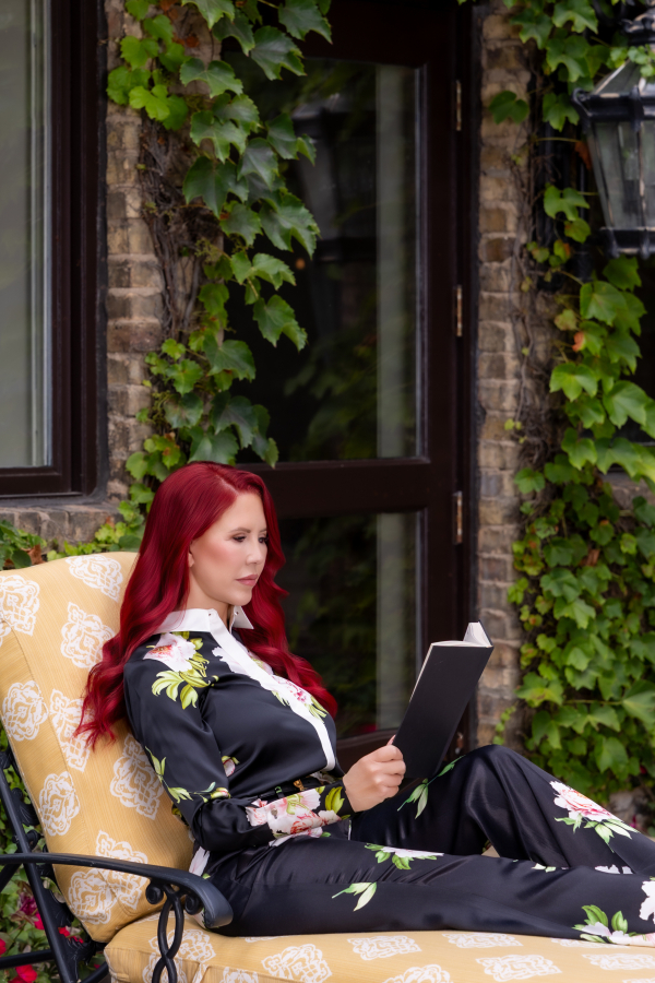 Dr. Stacie Stephenson reading outdoors